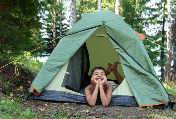 child in tent smiling backpacking tents
